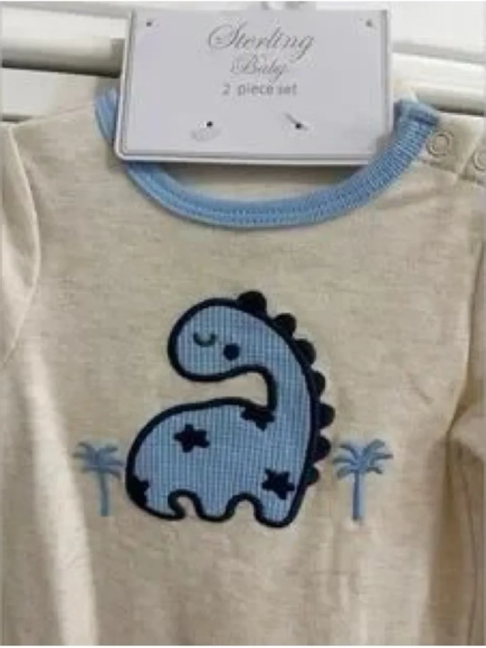 Cream One-Piece with Blue Dino Applique